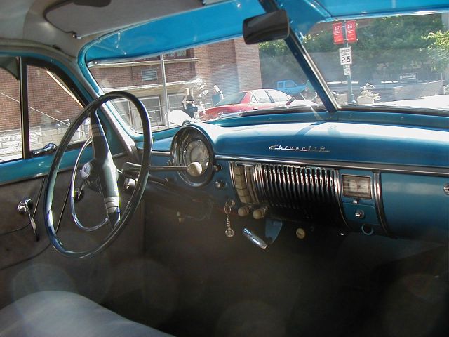 New Chevy through windshield of old Chevy.